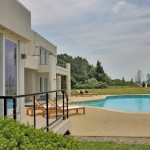 Pool and outdoor entertaining area of renovated modern home on the Maryland Eastern Shore